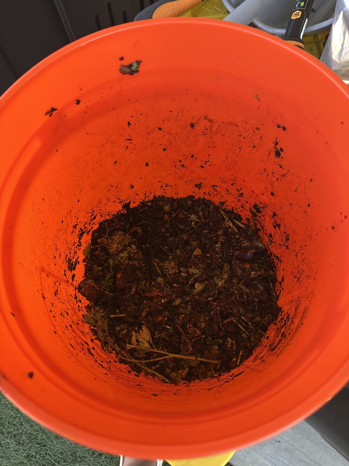 Chopped and mixed feedstock in a bucket prepared for hot composting